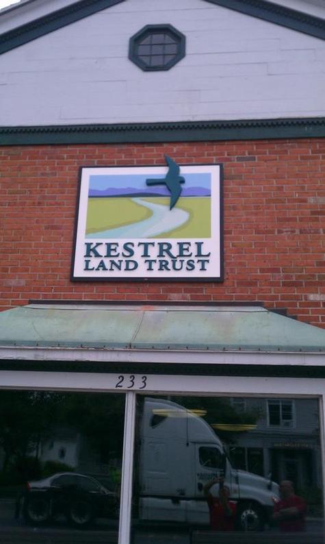 Kestral Land Trust - Custom dimensional letters on our custom backdrop mounted to brick facade