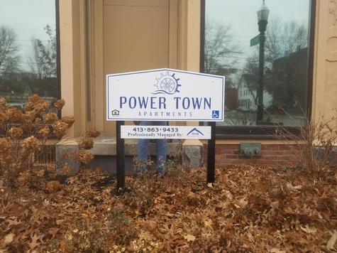 Carved letter sign- POWERTOWN Apartments